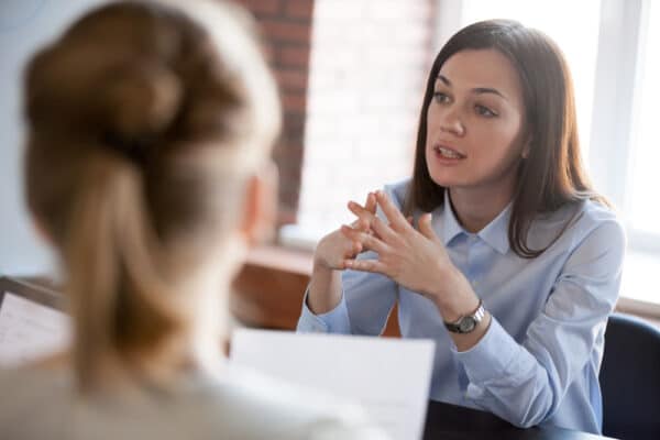 Confident,Focused,Businesswoman,,Teacher,Or,Mentor,Coach,Speaking,To,Business