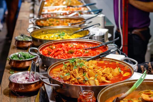 Variety,Of,Cooked,Curries,On,Display,At,Camden,Market,In