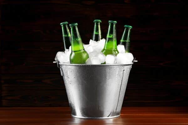 Metal,Bucket,With,Bottles,Of,Beer,And,Ice,Cubes,On
