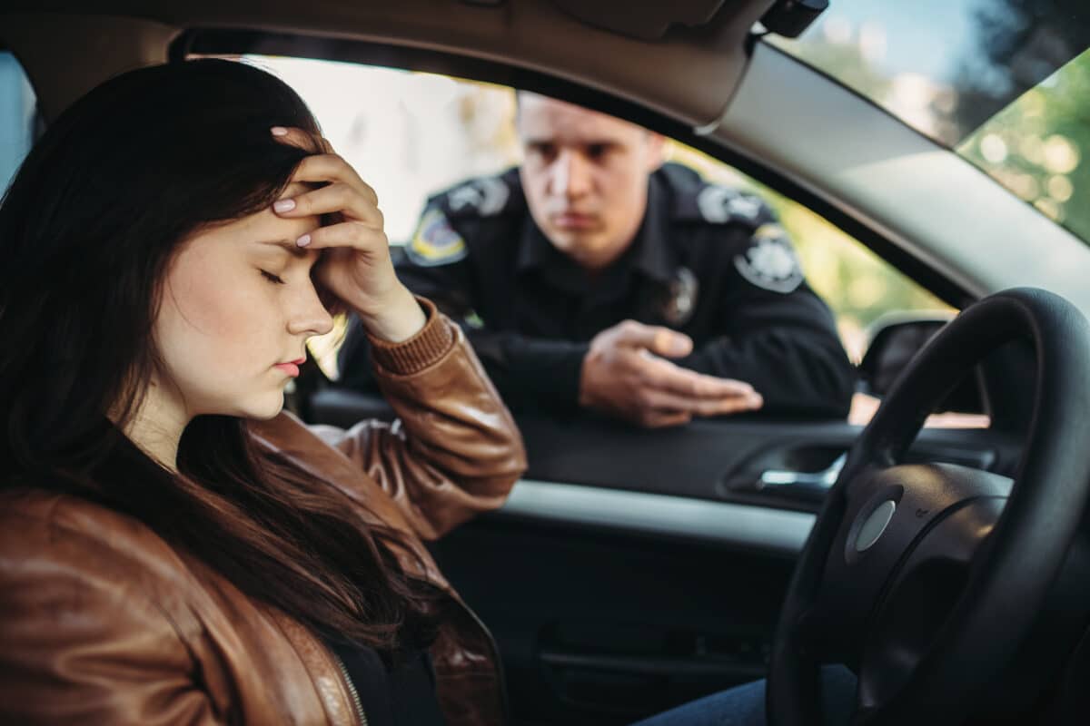 Male,Cop,In,Uniform,Check,Female,Driver,On,Road