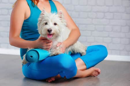 Closeup,Picture,Of,A,Yoga,Girl,Hugging,Her,Doggie