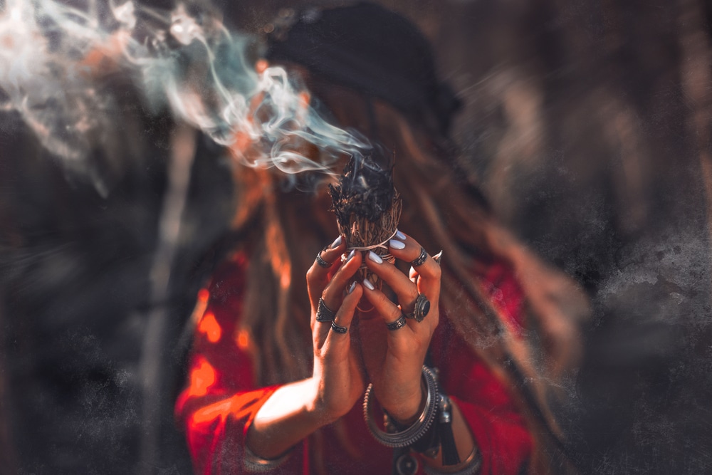 Close,Up,Of,Woman,Hands,With,Shamanic,Fire,Outdoors