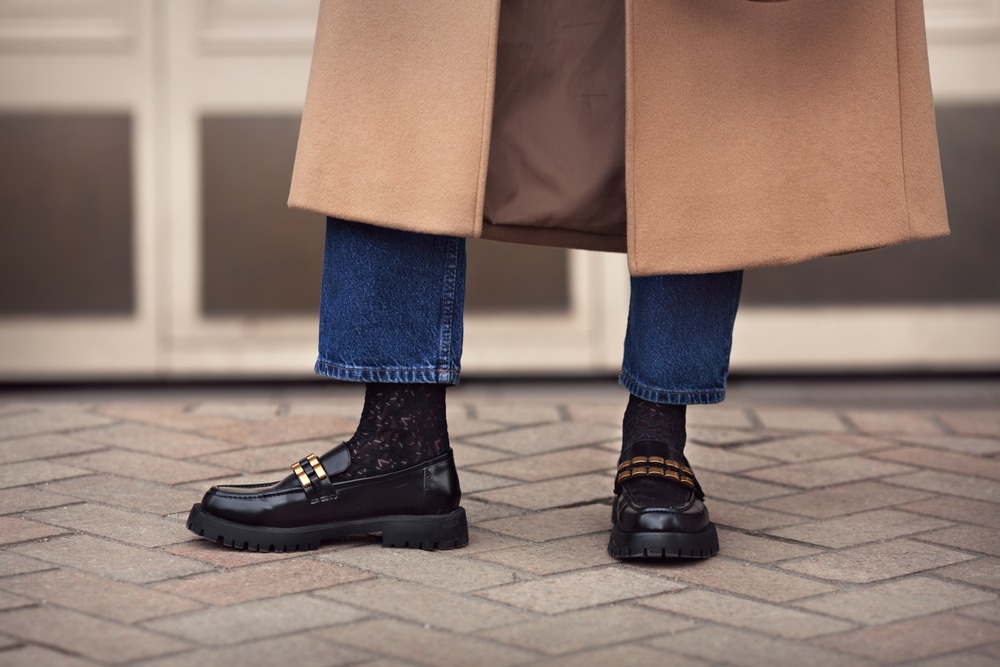 Close,Up,Female,Legs,In,Jeans,,Stylish,Black,Loafers,Shoes