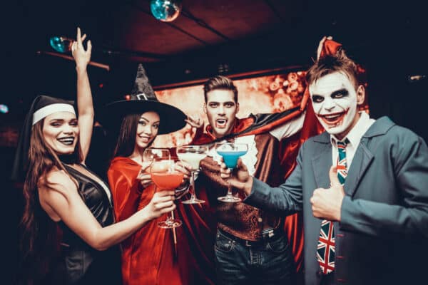 Friends,In,Halloween,Costumes,Drinking,Cocktails ,Group,Of,Young,Happy, Halloween Party Wien 2024