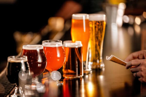 A,Variety,Of,Beer,Glasses,Lined,Up,On,A,Bar
