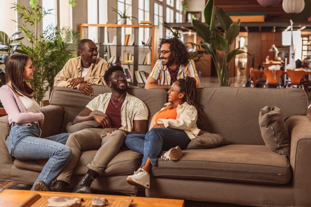 Team,Of,Young,Cheerful,Multicultural,Managers,Sitting,On,The,Couch