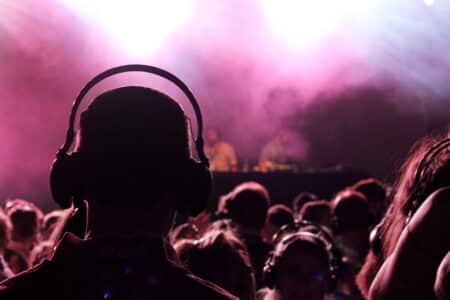 A,Man,Wearing,A,Pair,Of,Headphones,Enjoying,A,Silent