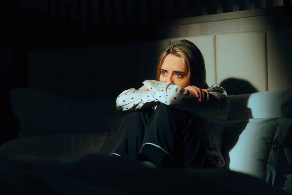 Sad,Woman,Sitting,In,Bed,Feeling,Depressed,And,Anxiou ,Unhappy