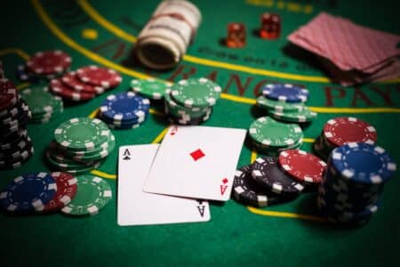 A,Closeup,Cards,And,Different,Chips,Spread,On,A,Poker