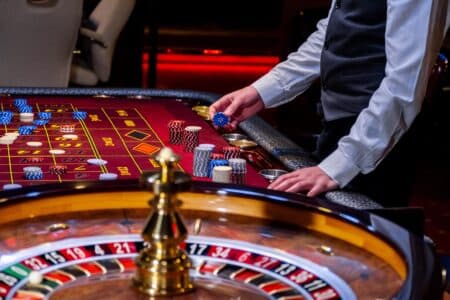 Croupier,Behind,Gambling,Table,In,A,Casino ,Roulette,Wheel,And