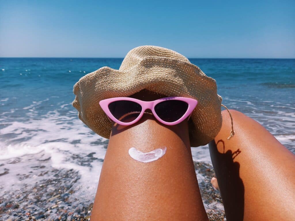 beach fun with sunglasses hat and sunscreen utc
