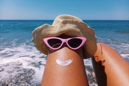 beach fun with sunglasses hat and sunscreen utc